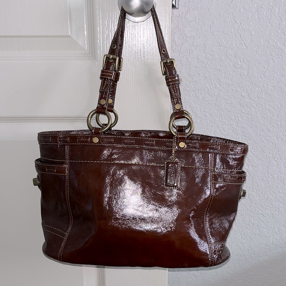 Coach EUC Y2K Shiny Leather Brown Shoulder Bag.  Cross locks on side pockets.